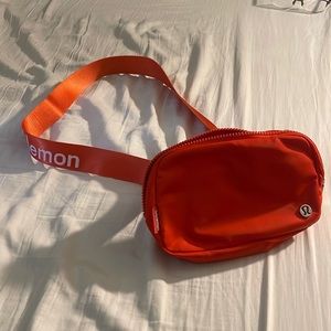 Lulu lemon solar orange every day belt bag.